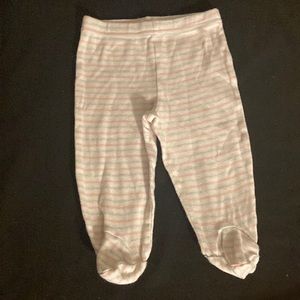 White pants with pink and gray stripes